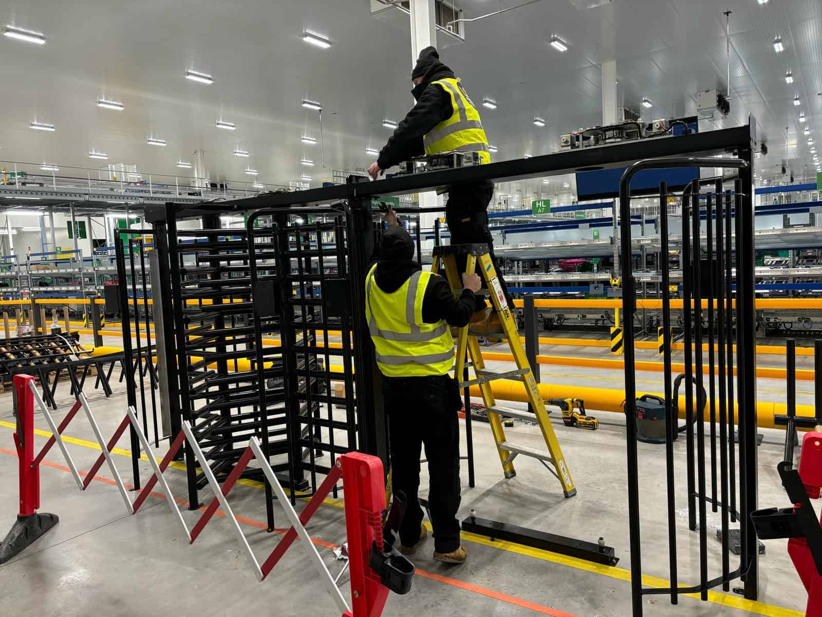 UK Turnstiles installing UKT-40 full height Turnstiles at Derby College