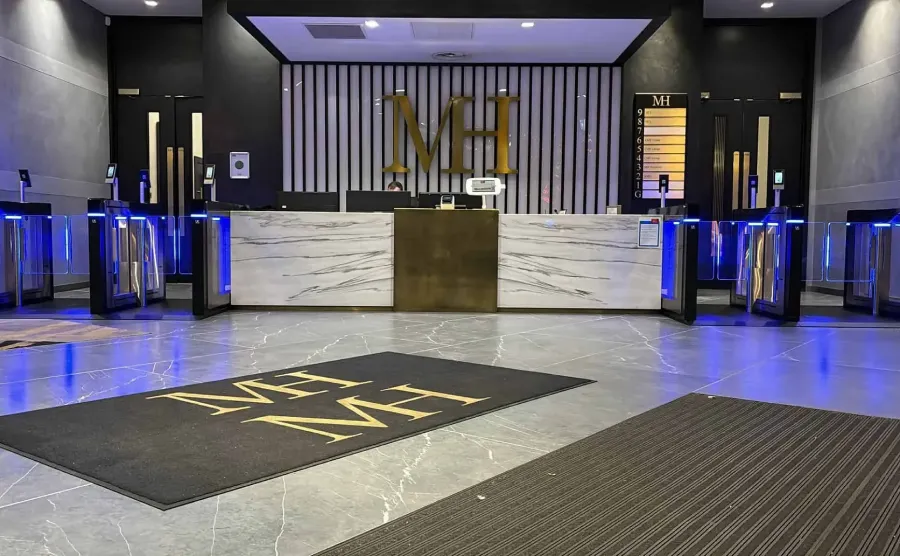 Speed gate turnstiles installed at a premium office Speed-gate turnstiles installed at a premium office reception with blue LED lighting
