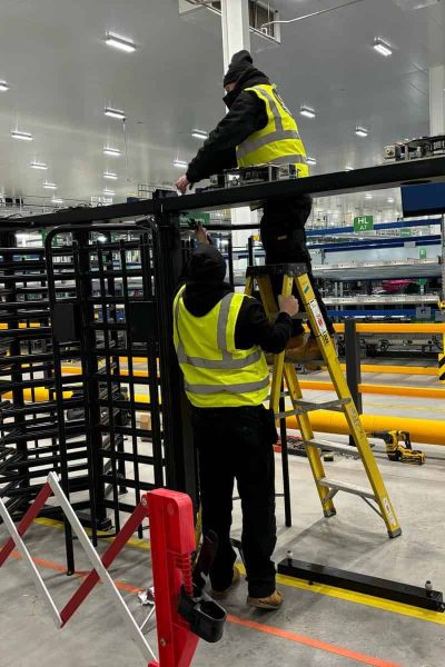 UK Turnstiles installing UKT-40 full height Turnstiles at Derby College